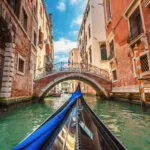 View from gondola during the ride through the canals of Venice i