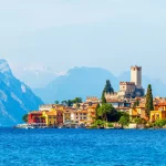 Ancient tower and colorful houses in malcesine old town