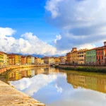 Pisa, Arno river, lamp and buildings reflection. Lungarno view.