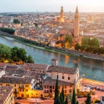 Verona panoramic aerial view on illuminated old town on the sunset in Italy